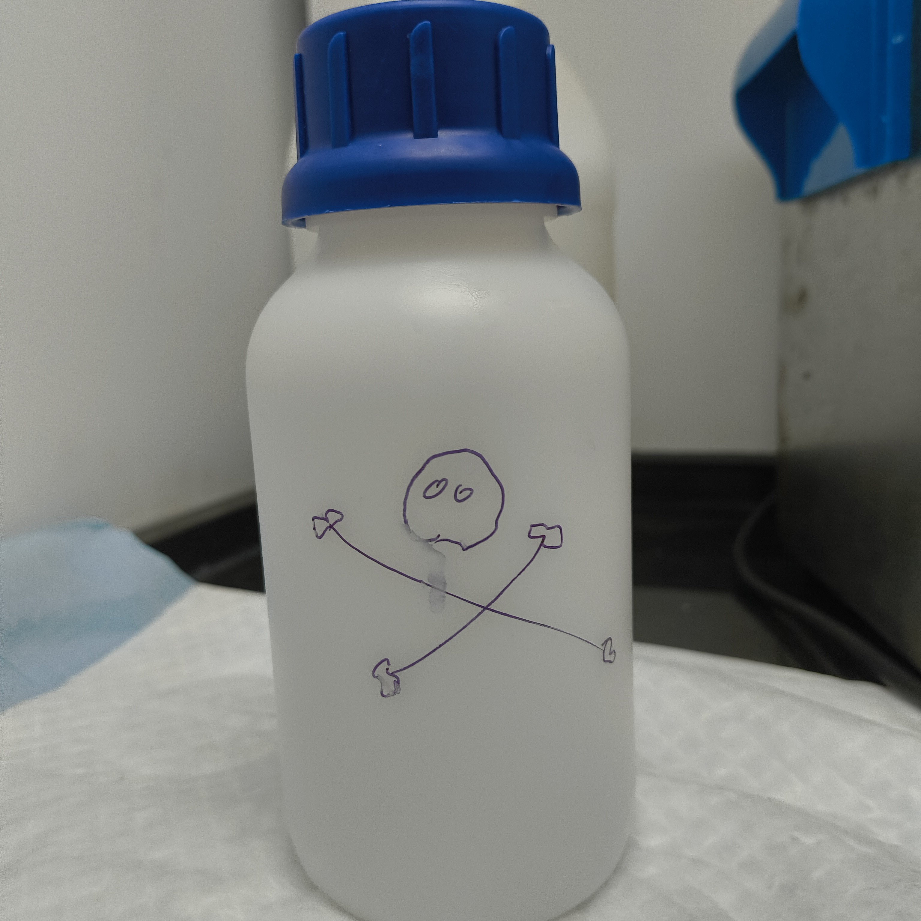 Bottle with a very cute hazardous waste sign drawn by Jehan